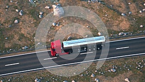 Semi-trailer tank truck driving along a desert road