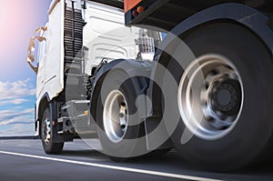 Semi Trailer Truck Driving on Highway Road. Truck Wheels Spining. Industry Road Freight Truck. Logistic and Cargo Transport.