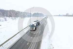 A semi-trailer truck, semitruck, tractor unit and semi-trailer to carry freight.