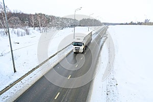 A semi-trailer truck, semitruck, tractor unit and semi-trailer to carry freight.