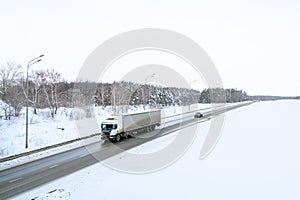 A semi-trailer truck, semitruck, tractor unit and semi-trailer to carry freight.