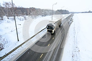 A semi-trailer truck, semitruck, tractor unit and semi-trailer to carry freight.