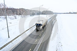 A semi-trailer truck, semitruck, tractor unit and semi-trailer to carry freight.