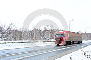 A semi-trailer truck, semitruck, tractor unit and semi-trailer to carry freight.