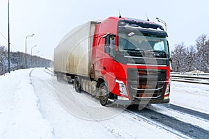 A semi-trailer truck, semitruck, tractor unit and semi-trailer to carry freight.