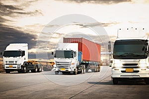 Semi Trailer Trucks Driving on The Road with The Sunset. Shipping Cargo Container. Freight Truck Logistic. Cargo Transport