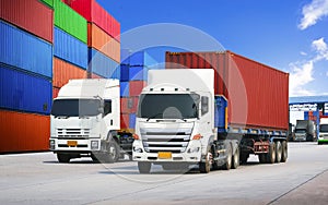 Semi trailer Trucks on The Road and Stacked of Containers Cargo Shipping. Cargo Container ships, Freight Trucks Import-Export.