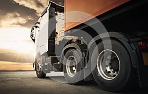 Semi TrailerTrucks Parked with The Sunset Sky. Shipping Container. Engine Diesel Trucks. Lorry Tractor. Freight Trucks Logistics.