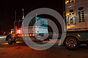 Semi truck attached to a animal carrier trailer/ Parked truck an