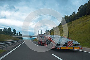Semi truck with car carrier trailer