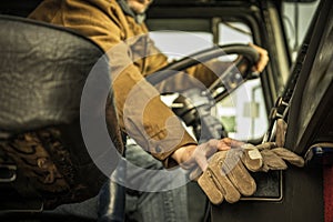 Semi Truck Driver Behind His Classic Truck Steering Wheel