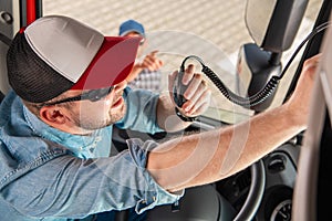 Semi Truck Driver Communicating Using CB Radio