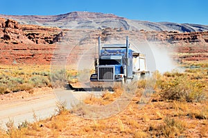 Semi-truck driving across the desert