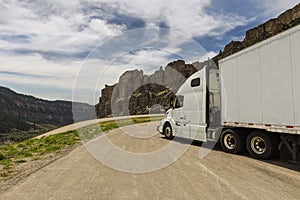 Semi truck parked on rest area in mountain