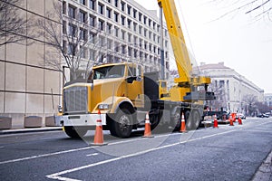 Semi truck power craine on urban city street Washington DC