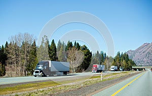 Semi trucks trucking convoy interstate highway California photo