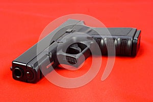 Semiauto handgun on red background