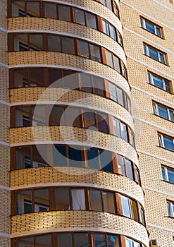 Semicircular balconies in modern residential building.