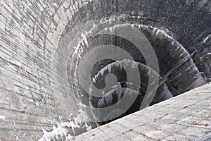 Semicircular spillway of Moiry Dam at the head of the Grimentz Valley, Switzerland.