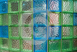 Semicircular wall made of glass tiles in the bathroom