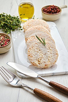 Semifinished chicken cutlet in breading photo