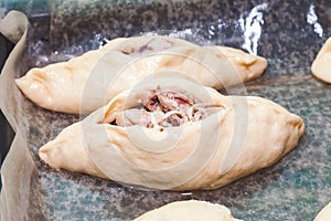 Semifinished pie with an open filling photo