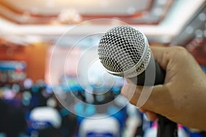 Seminar Conference Concept : hands businesspeople holding microphones for speech or speaking  in seminar room, talking for lecture