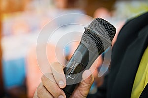 Seminar Conference Concept : hands businesspeople holding microphones for speech or speaking  in seminar room, talking for lecture