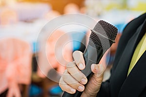 Seminar Conference Concept : hands businesspeople holding microphones for speech or speaking  in seminar room, talking for lecture