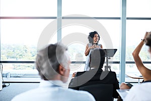 Seminar, presentation and woman presenter in the office boardroom for a business conference. Corporate speech, speaker