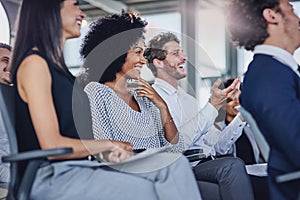 Seminars should be engaging. Low angle shot of a group of businesspeople sitting in the conference room during a seminar