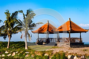 seminyak, bali, indonesia 10 june 2021 two gazebos on petitengat beach during the day look very warm