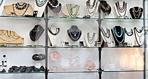 Semiprecious stone jewelry in glass case