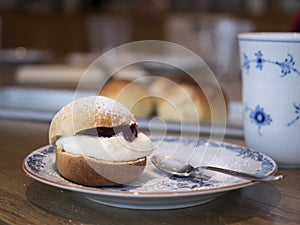 Semla or buns with cream and currant jelly