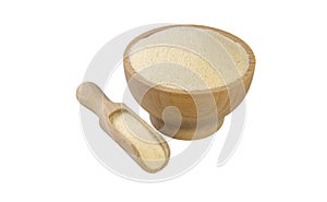 Semolina in wooden bowl and scoop isolated on white background. nutrition. bio. natural food ingredient
