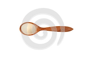 Semolina in wooden spoon on white background, top view. Design element, copy space