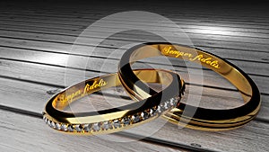Semper fidelis, which means `Always loyal` - warm, glowing words inside two tied golden rings to symbolize eternal love photo