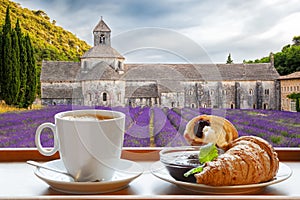 Senanque monastery against coffee with croissants in Gordes, Provence, France