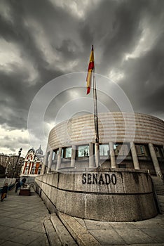 Senate building under an overcast grey sky in Madri