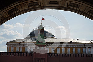 The Senate Palace in the Kremlin against the background of white clouds on a clear sunny day, Moscow