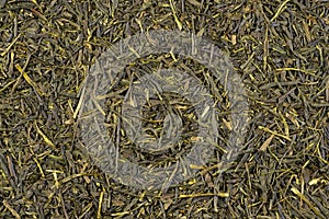 Sencha. Dried green tea leaves background
