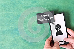 Send password text message smishing scam concept. Hand holding phone with message from unknown sender.
