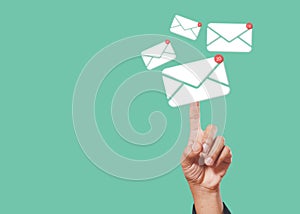Sending email contact network concept. Hands finger touch pointing email contact icons green background, communication message