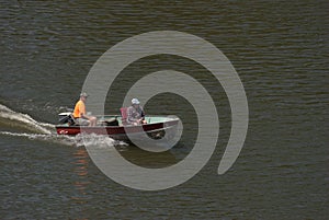 A man and woman are enjoying boating on the Illinois River at Seneca, Illinois.