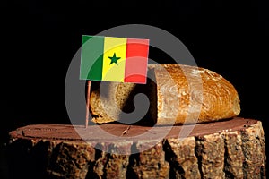 Senegal flag on a stump with bread