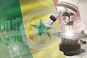Senegal science development digital background - microscope on flag. Research of genetics design concept, 3D illustration of