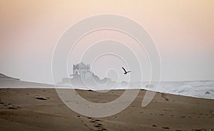 Senhor da Pedra Chapel and Seagull at Sunset