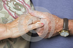 Senior Adult Couple Holding Hands