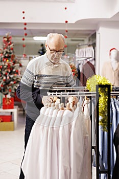 Senior adult looking for clothing items