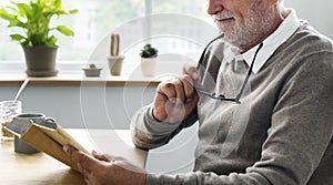 Senior Adult Reading Book Leisure Hobby Concept photo